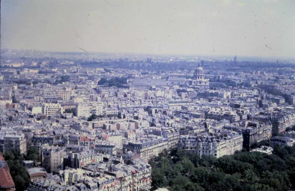 Popular Tourist Cities Aerial view of Paris showcasing classic architecture and expansive skyline.